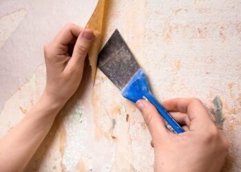 The Removal Of Wallpaper In A Home